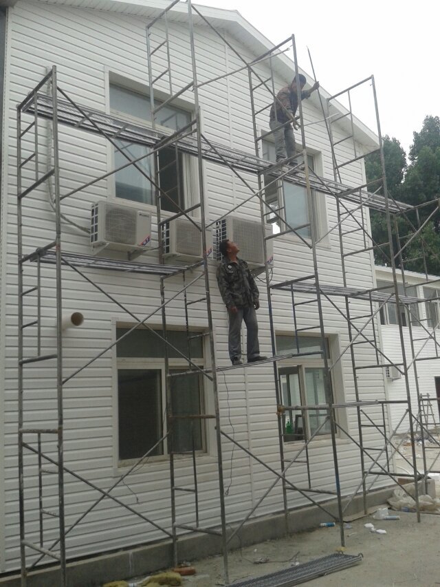轻钢别墅PVC外墙板 外墙改造板 仿木纹干挂防水扣板 户外装饰板