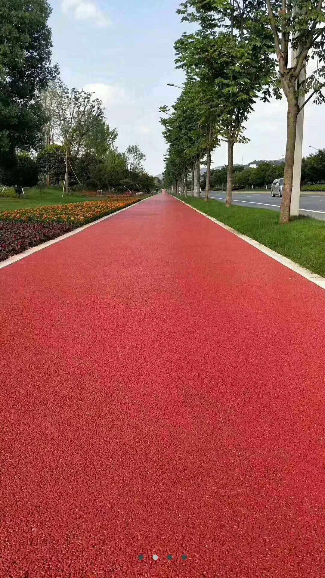 无砂透水材料价格 丽水湖景公园健身步道红色透水路面摊铺